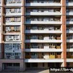 Home 20 북한의 주거 형태 공동주택 구조 - A detailed, high-rise North Korean residential building complex showcasing multiple floors with smal...